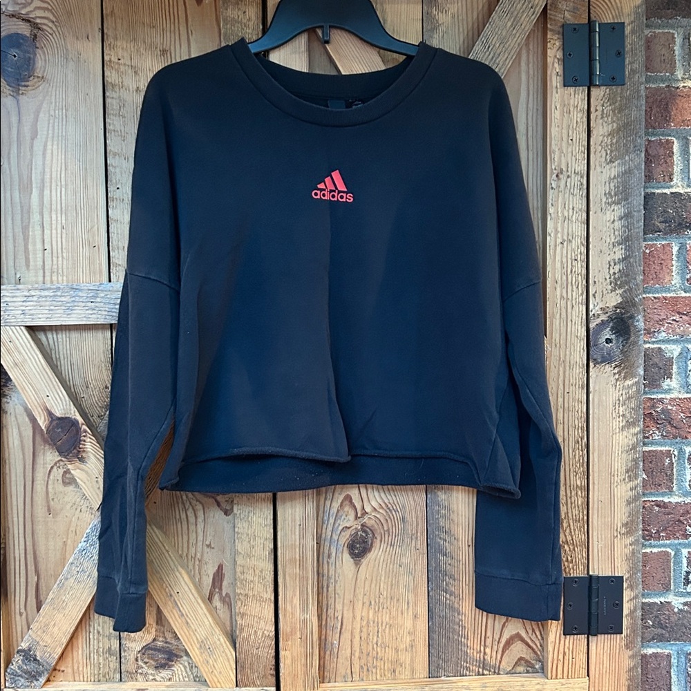 Women’s Adidas Black Crop Top sweatshirt with multi-colored logo. Size L.